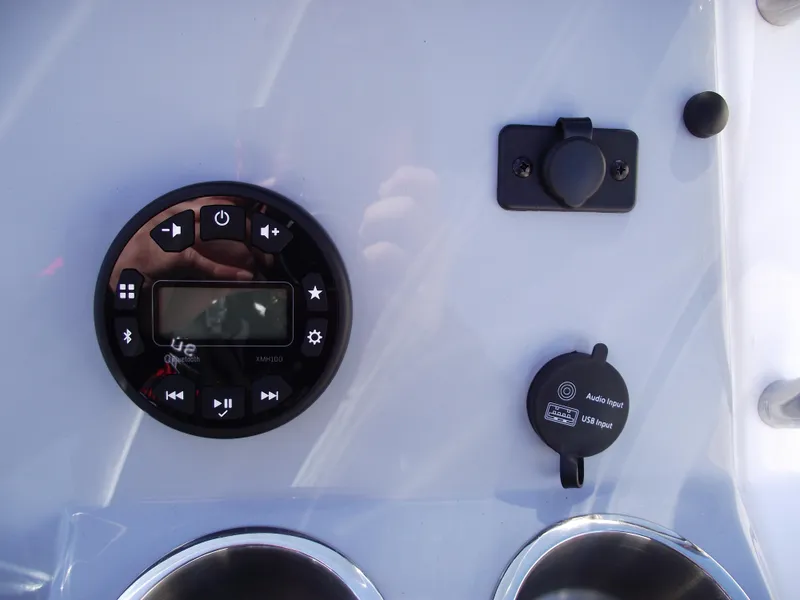 Slide: The Image of 2024 Bayliner CC20 boat interior with storage compartment and control panel. - 23
