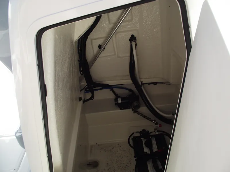 Slide: The Image of 2024 Bayliner CC20 boat interior with cushioned seating. - 26