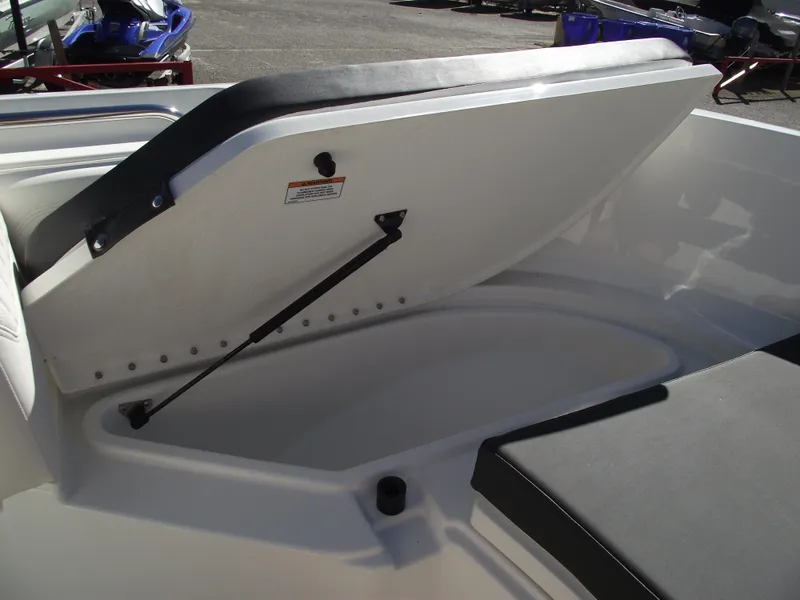 Slide: The Image of 2024 Bayliner CC20 boat storage compartment with open lid. - 32
