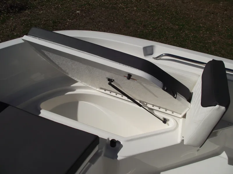 Slide: The Image of 2024 Bayliner CC20 boat storage compartment with open lid. - 34