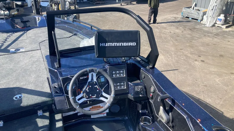 Slide: The Image of 2024 Skeeter WXR 2060 F boat dashboard with Humminbird fish finder and steering wheel. - 4