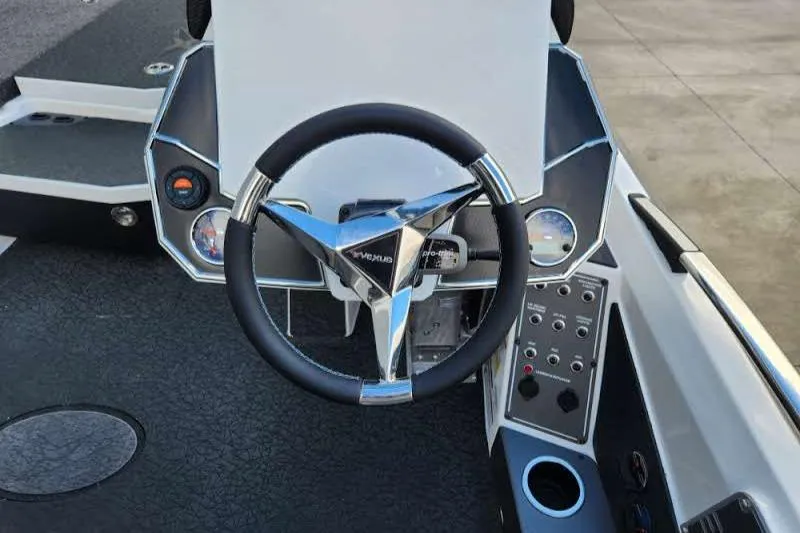 Slide: The Image of 2024 Vexus VXS20 boat dashboard with steering wheel and control panel. - 4