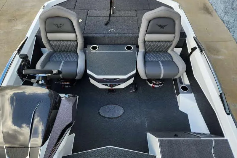 Slide: The Image of 2024 Vexus VXS20 boat interior with dual seats and steering console. - 5