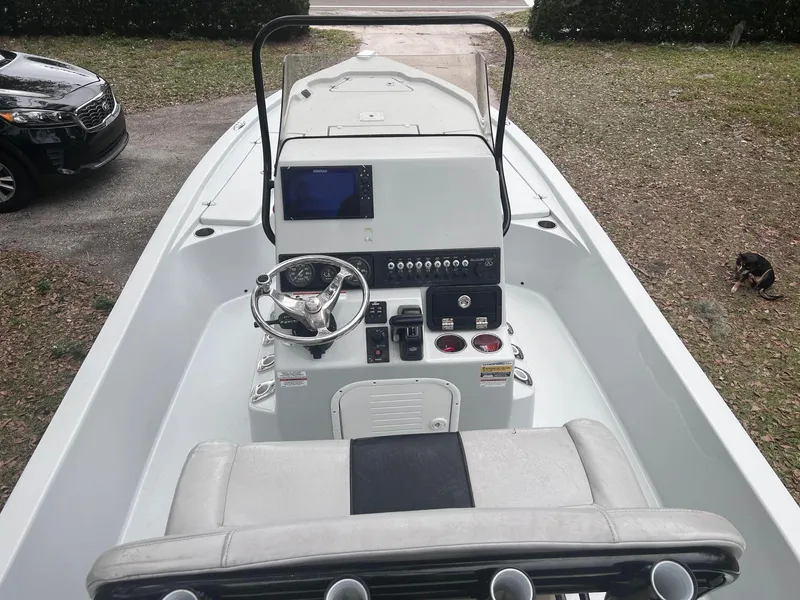 Slide: The Image of 2020 Blazer 2200 Fisherman boat interior with steering console and navigation system. - 7