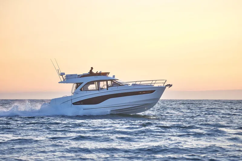 Slide: The Image of 2025 Beneteau Antares 12 yacht cruising at sunset. - 15