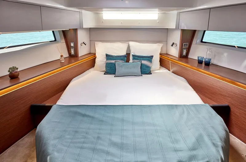Slide: The Image of Luxurious bedroom in 2025 Beneteau Antares 12 yacht with ocean view. - 3