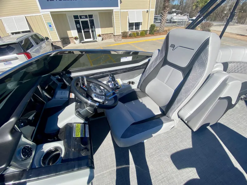 Slide: The Image of 2023 Vanderbilt 700T boat interior with captain's seat and control panel. - 15