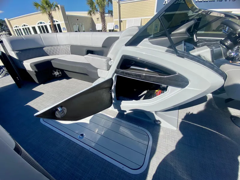 Slide: The Image of 2023 Vanderbilt 700T boat interior with open storage compartment and seating area. - 20