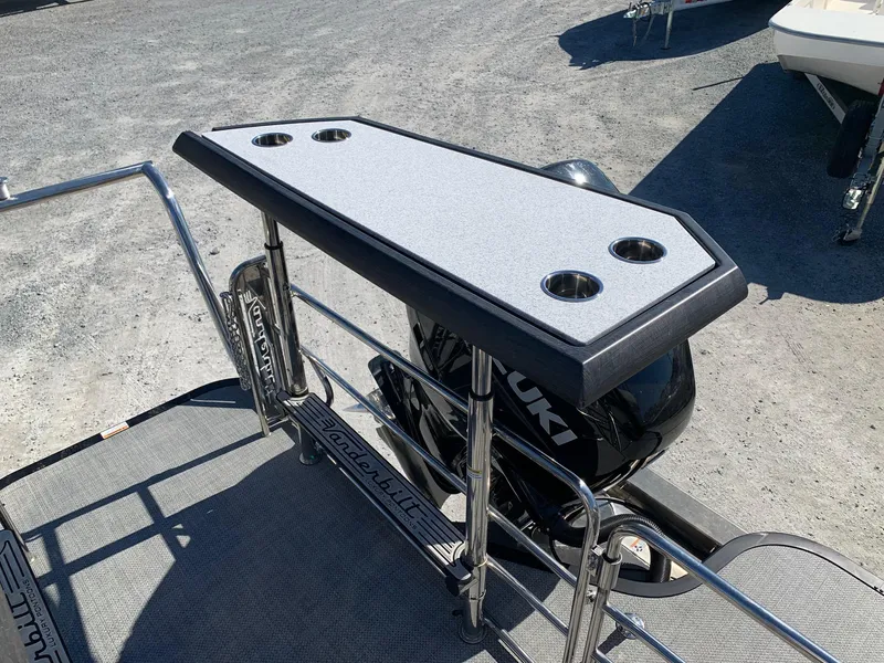 Slide: The Image of Vanderbilt 700T 2023 boat with Suzuki outboard motor and fishing rod holders. - 28