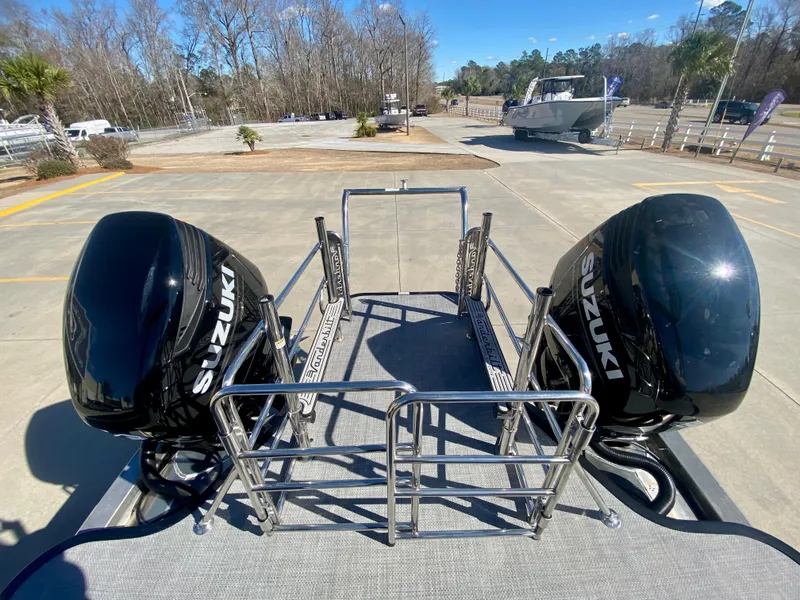 Slide: The Image of Vanderbilt 700T 2023 model boat with dual Suzuki outboard motors. - 9