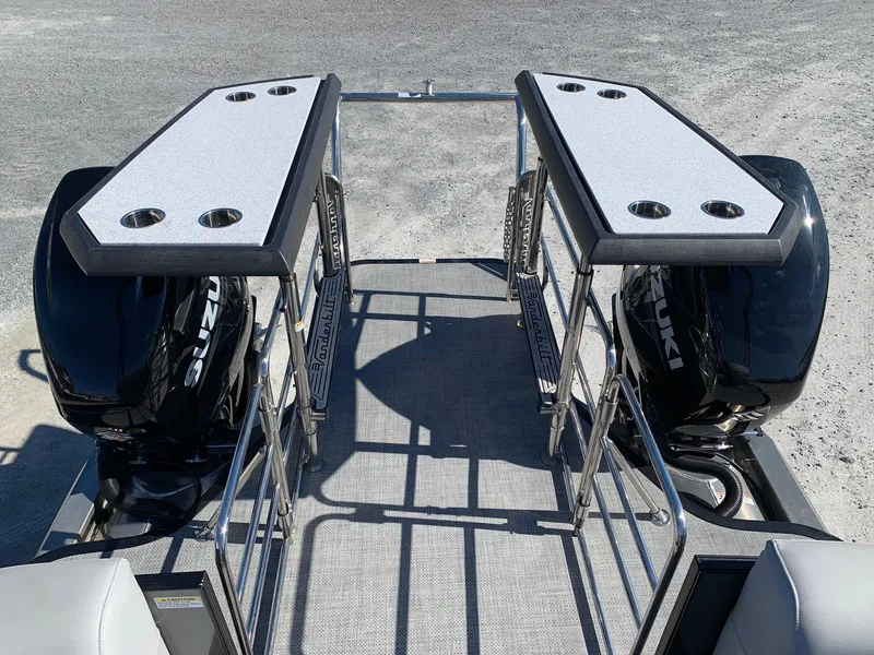 Slide: The Image of 2023 Vanderbilt 700T boat with dual Suzuki engines and spacious deck. - 27