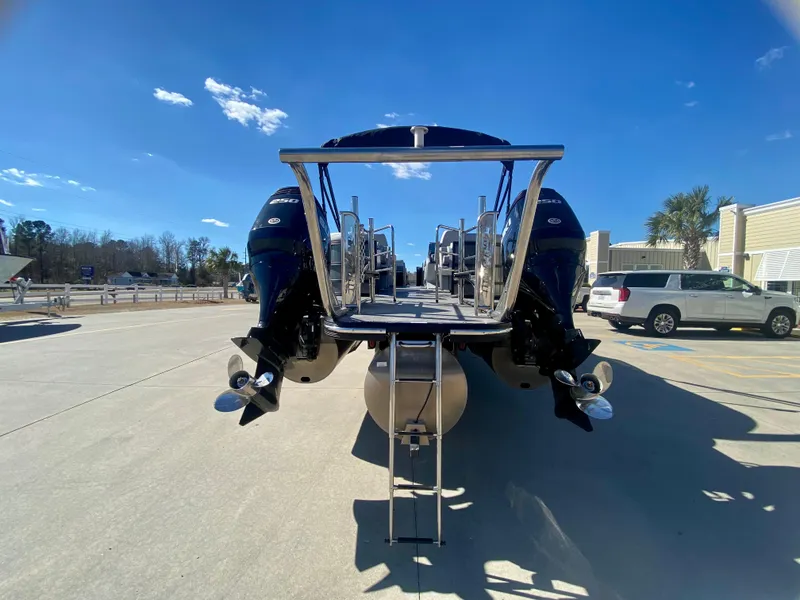 Slide: The Image of Rear view of 2023 Vanderbilt 700T boat with dual outboard motors. - 4