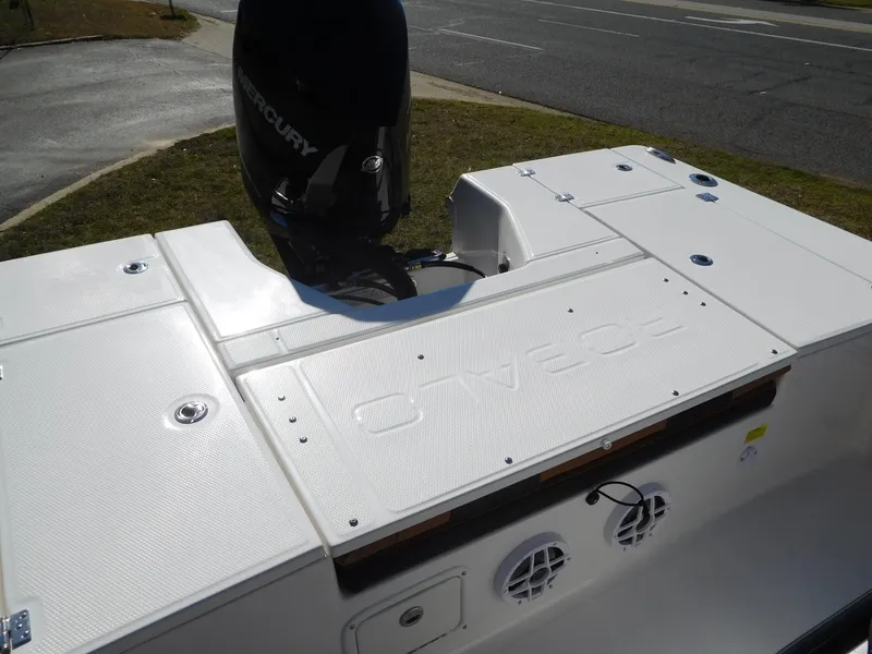 Slide: The Image of 2024 Robalo 226 Cayman boat with Mercury outboard motor, rear deck view. - 13