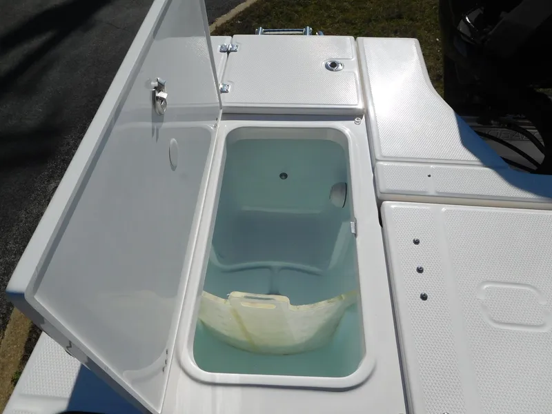 Slide: The Image of 2024 Robalo 226 Cayman boat livewell with open lid. - 18