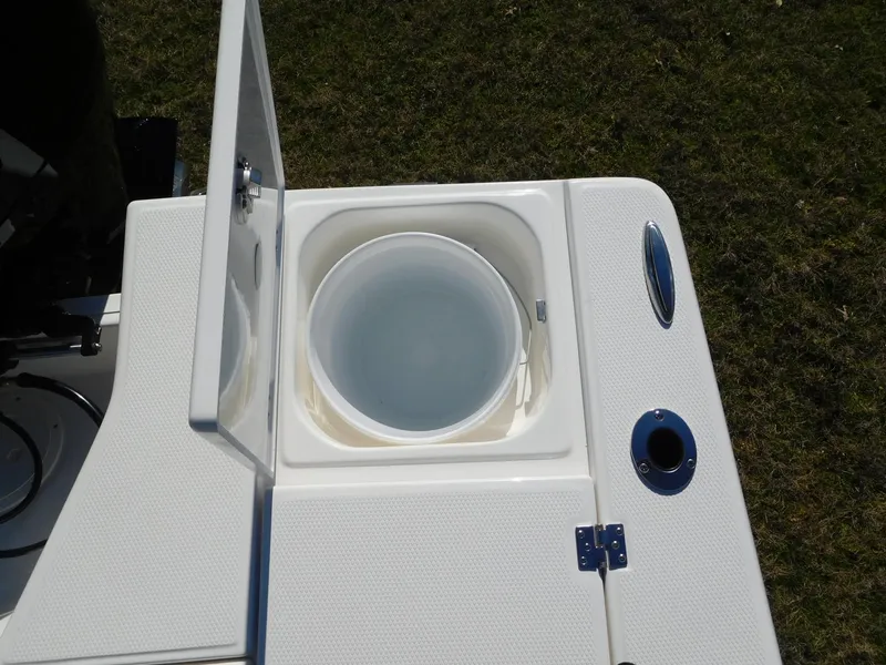 Slide: The Image of 2024 Robalo 226 Cayman livewell with open lid on deck. - 19