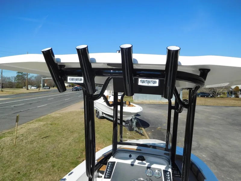 Slide: The Image of 2024 Robalo 226 Cayman boat with T-top and rod holders. - 20