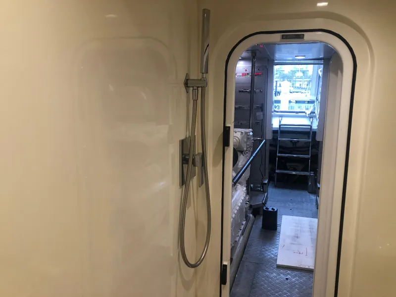 Slide: The Image of Interior view of 2012 Monte Carlo Yachts 76, showing a shower and doorway. - 16