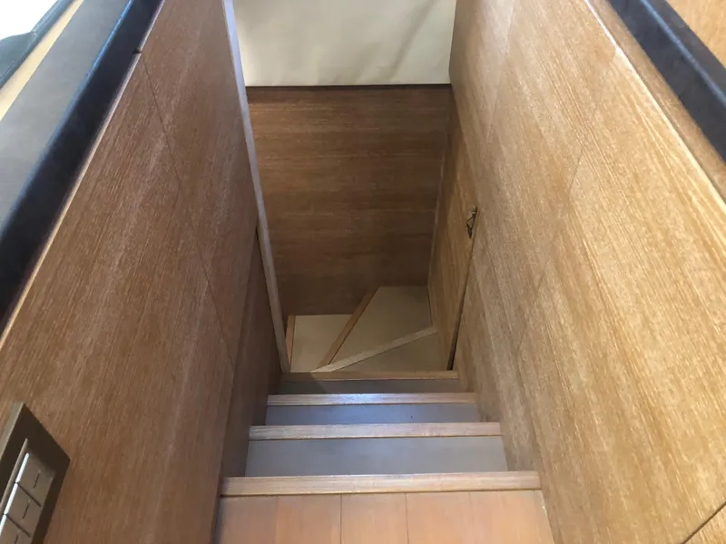 Slide: The Image of Wooden staircase inside 2012 Monte Carlo Yachts 76 model. - 27