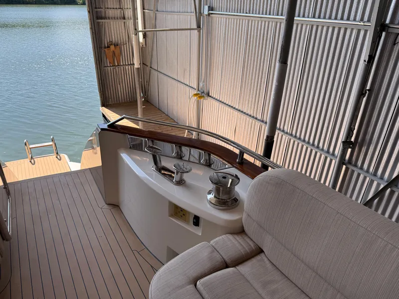 Slide: The Image of Luxury Monte Carlo Yachts 76, 2012 model, docked with elegant seating and water view. - 46