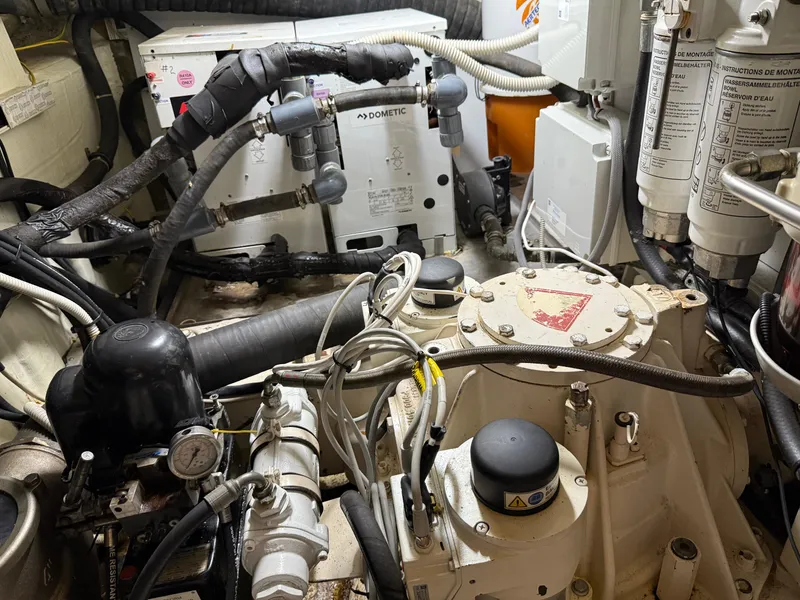 Slide: The Image of Engine room of a 2012 Monte Carlo Yachts 76, showcasing mechanical components and systems. - 47