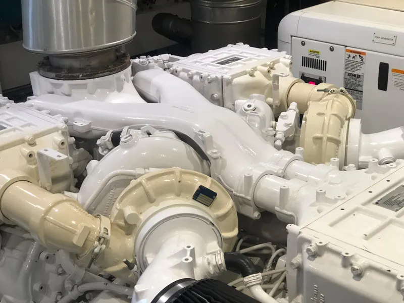 Slide: The Image of Engine room of a 2012 Monte Carlo Yachts 76, showcasing mechanical components. - 50