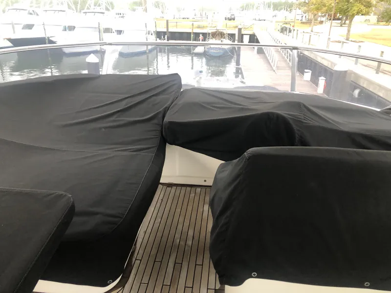 Slide: The Image of Covered seating area on the deck of a 2012 Monte Carlo Yachts 76. - 14