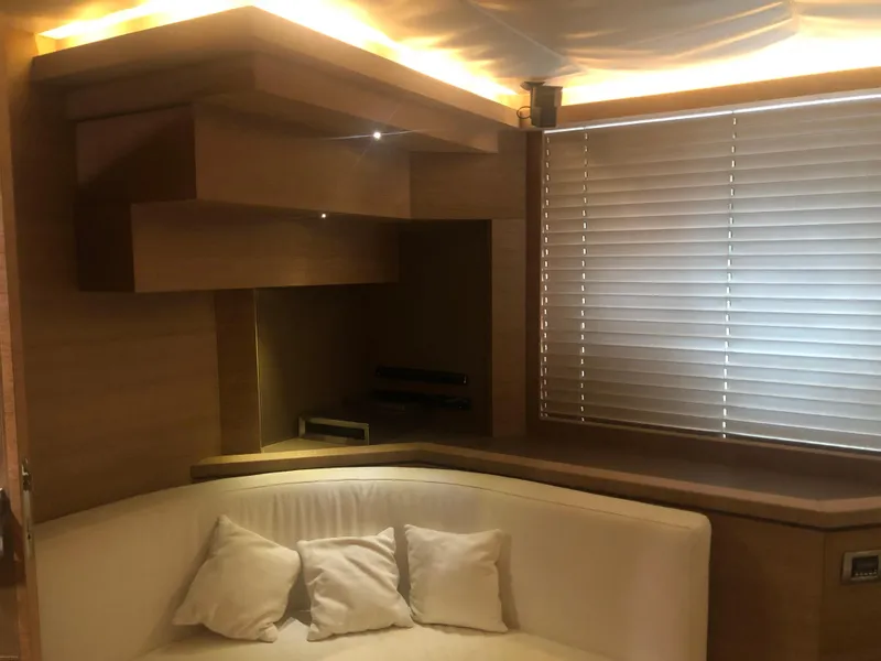 Slide: The Image of Luxurious interior of 2012 Monte Carlo Yachts 76 with modern wood finish and cozy seating. - 25