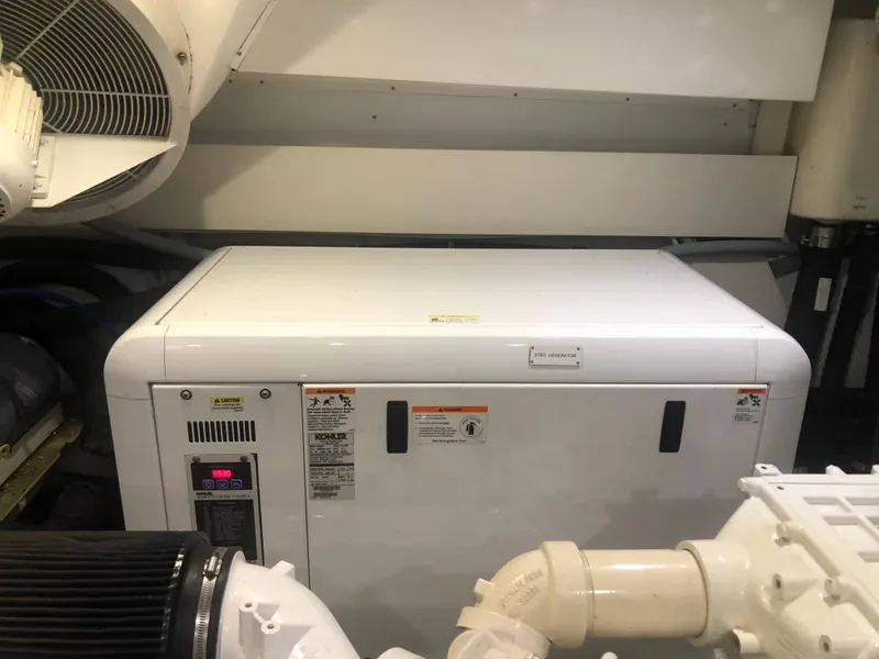 Slide: The Image of Kohler generator in the engine room of a 2012 Monte Carlo Yachts 76. - 38