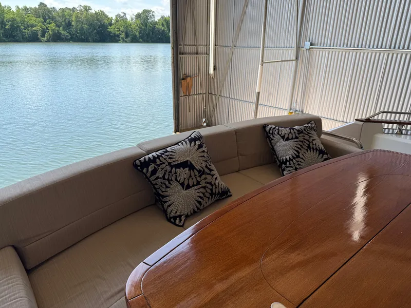 Slide: The Image of Luxurious seating area on 2012 Monte Carlo Yachts 76, overlooking serene water view. - 40