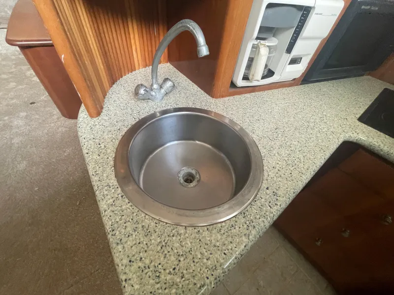 Slide: The Image of Stainless steel sink in 2001 Carver 444 Cockpit Motor Yacht kitchen area. - 44