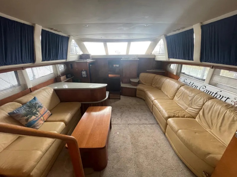 Slide: The Image of Luxurious interior of 2001 Carver 444 Cockpit Motor Yacht with beige leather seating. - 47