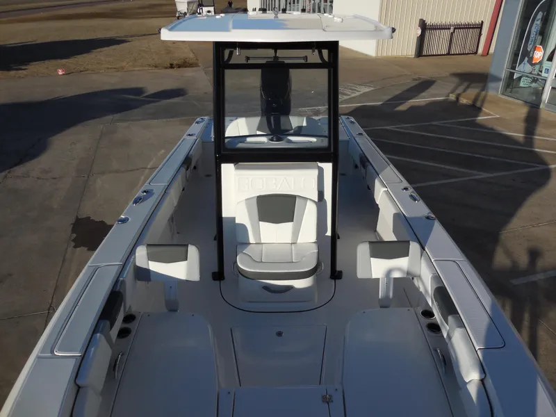 Slide: The Image of 2024 Robalo R266 Cayman boat with center console and seating. - 5