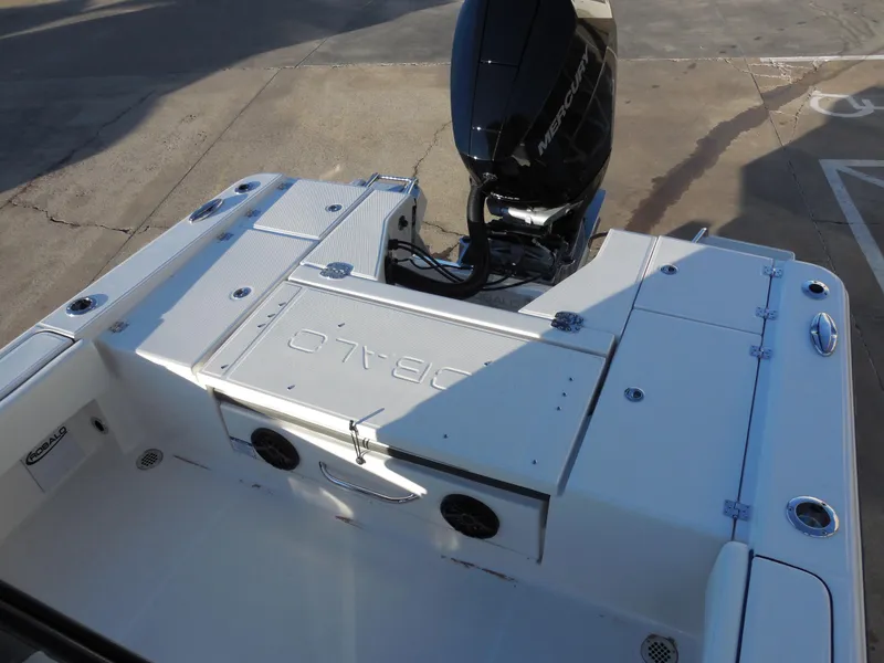 Slide: The Image of 2024 Robalo R266 Cayman boat stern with outboard motor. - 7