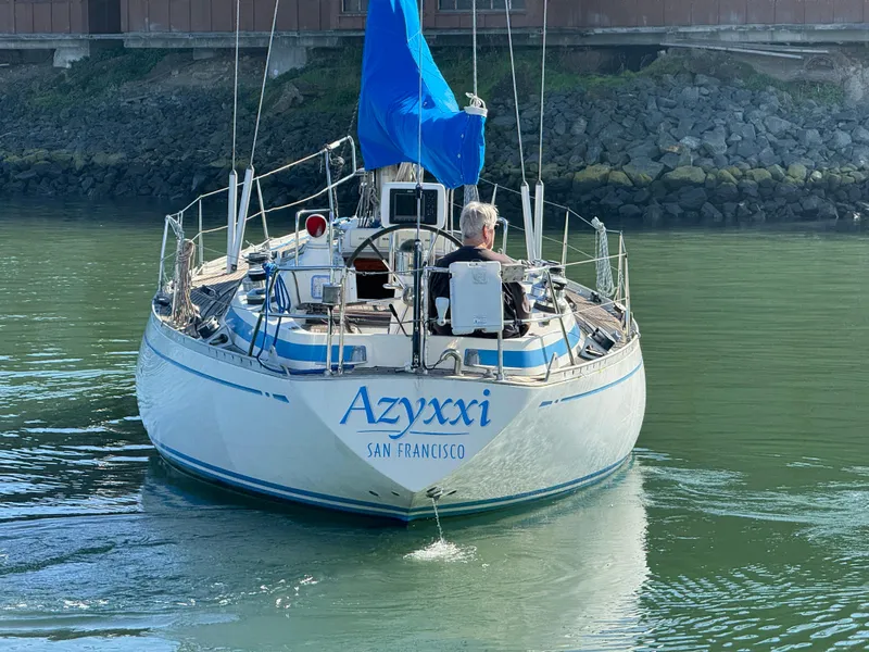 Slide: The Image of Nautor Swan 38 sailboat from 1974 named Azyxxi, sailing in calm waters. - 1