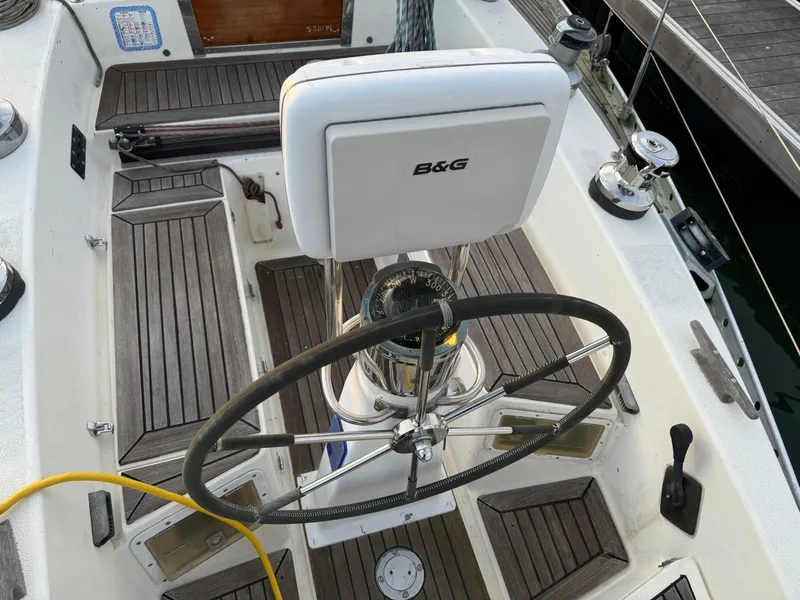 Slide: The Image of Cockpit of 1974 Nautor Swan 38 sailboat with steering wheel and B&G navigation system. - 4