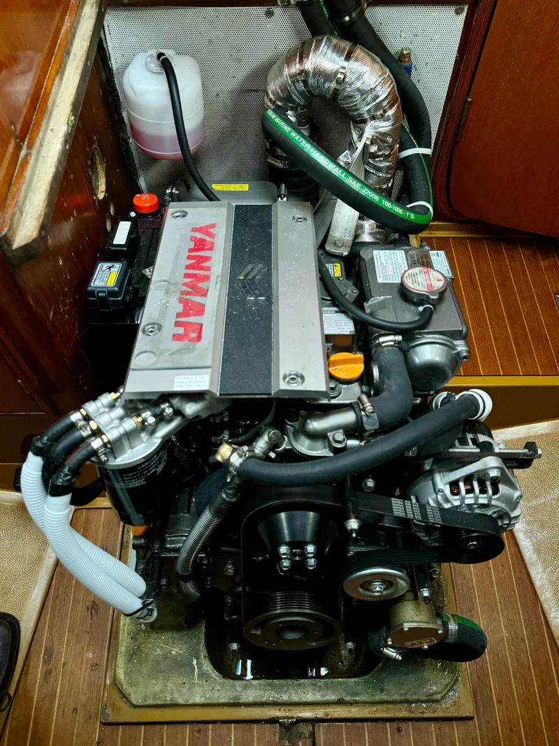 Slide: The Image of Yanmar engine in a 1974 Nautor Swan 38 sailboat, showcasing detailed mechanical components. - 6