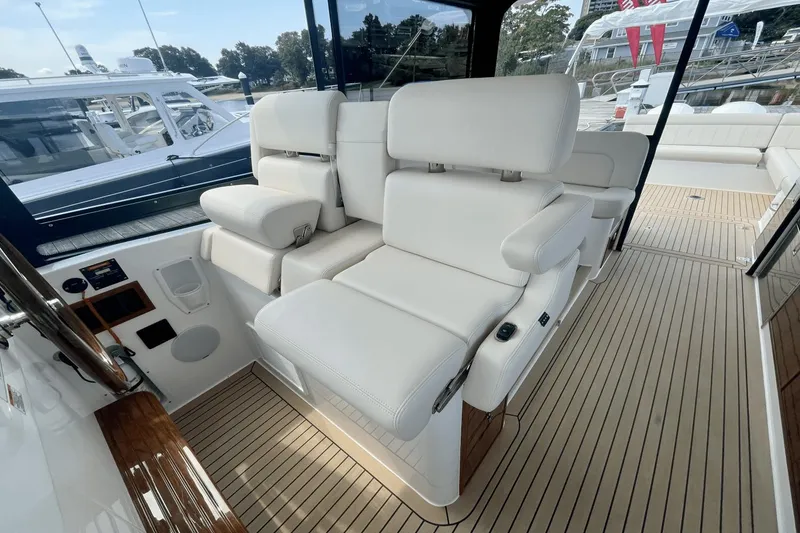 Slide: The Image of Luxurious seating on 2024 MJM 4 yacht, featuring elegant white upholstery and sleek design. - 13