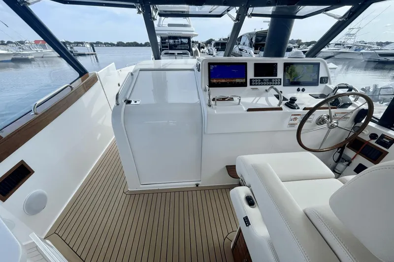 Slide: The Image of 2024 MJM 4 yacht cockpit with modern navigation equipment and luxurious seating. - 20