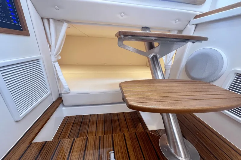 Slide: The Image of 2024 MJM 4 interior with wooden steps and cozy cabin space. - 23