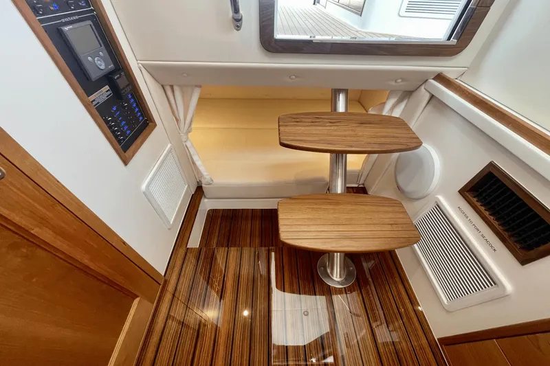 Slide: The Image of 2024 MJM 4 yacht interior with wooden steps and control panel. - 24