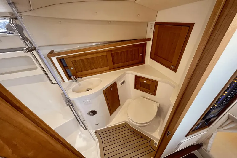 Slide: The Image of 2024 MJM 4 yacht bathroom with wooden cabinets and modern fixtures. - 25