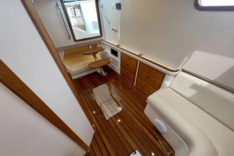 Slide: The Image of Luxurious interior of 2024 MJM 4 yacht with wood flooring and elegant seating. - 27