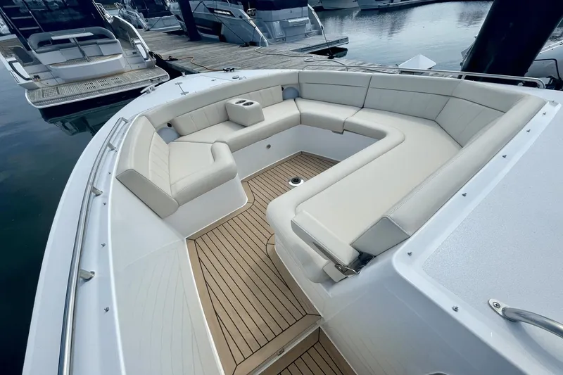 Slide: The Image of Luxurious seating area on 2024 MJM 4 boat with elegant design and wood flooring. - 29