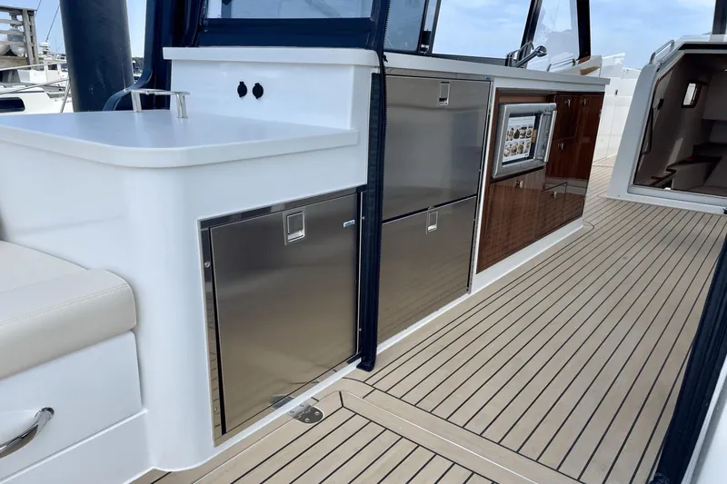 Slide: The Image of Luxurious 2024 MJM 4 yacht interior with sleek cabinetry and modern appliances. - 5