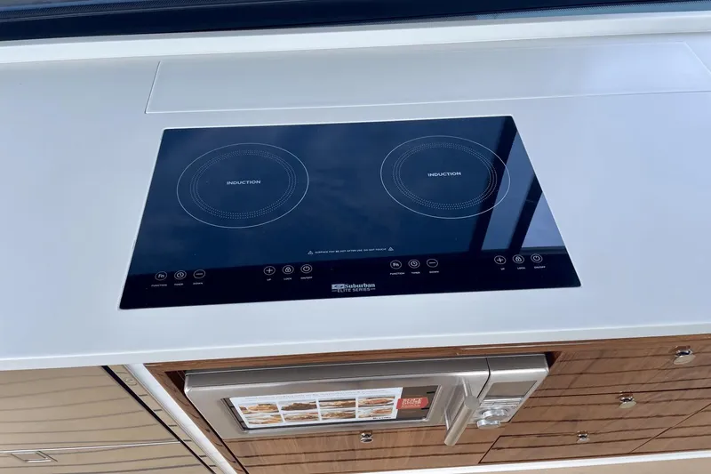 Slide: The Image of Modern induction cooktop and microwave in 2024 MJM 4 yacht kitchen. - 8