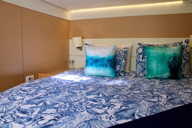 Slide: The Image of Luxurious bedroom in 2015 Lagoon 620 yacht with blue and white bedding. - 18