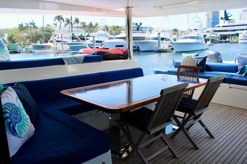 Slide: The Image of Luxurious Lagoon 620 catamaran 2015 model with spacious outdoor seating and dining area. - 20