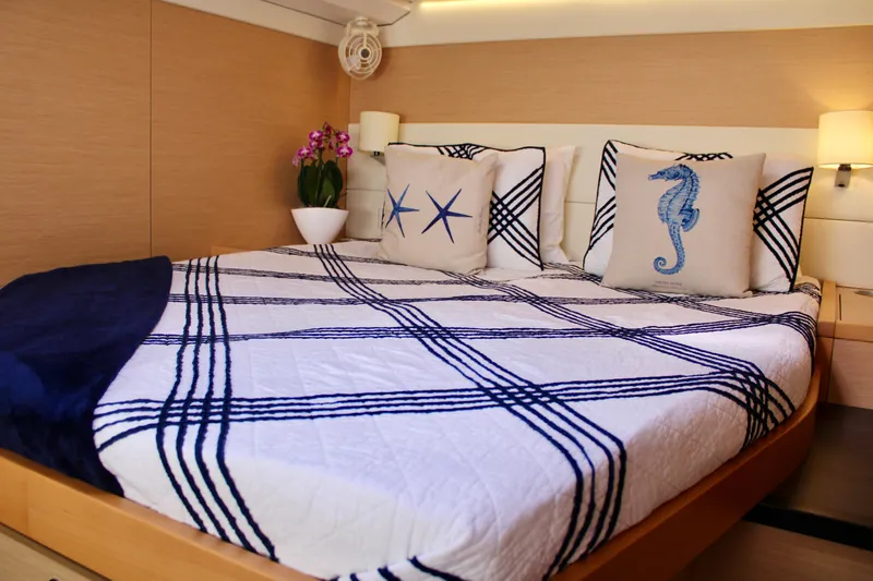 Slide: The Image of Luxurious bedroom interior of 2015 Lagoon 620 yacht with nautical-themed decor. - 36