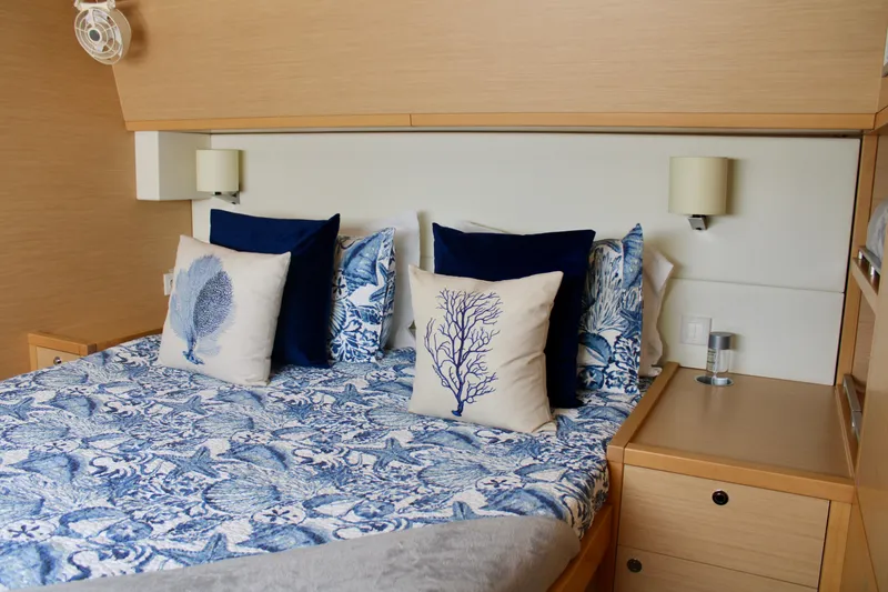 Slide: The Image of Luxurious bedroom in 2015 Lagoon 620 yacht with nautical-themed bedding and pillows. - 37