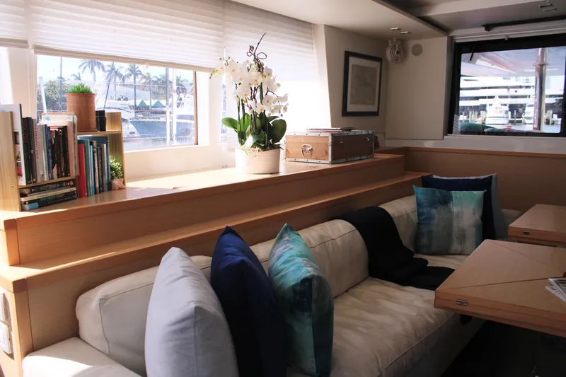 Slide: The Image of Interior of 2015 Lagoon 620 yacht with cozy seating, pillows, and decorative elements. - 38